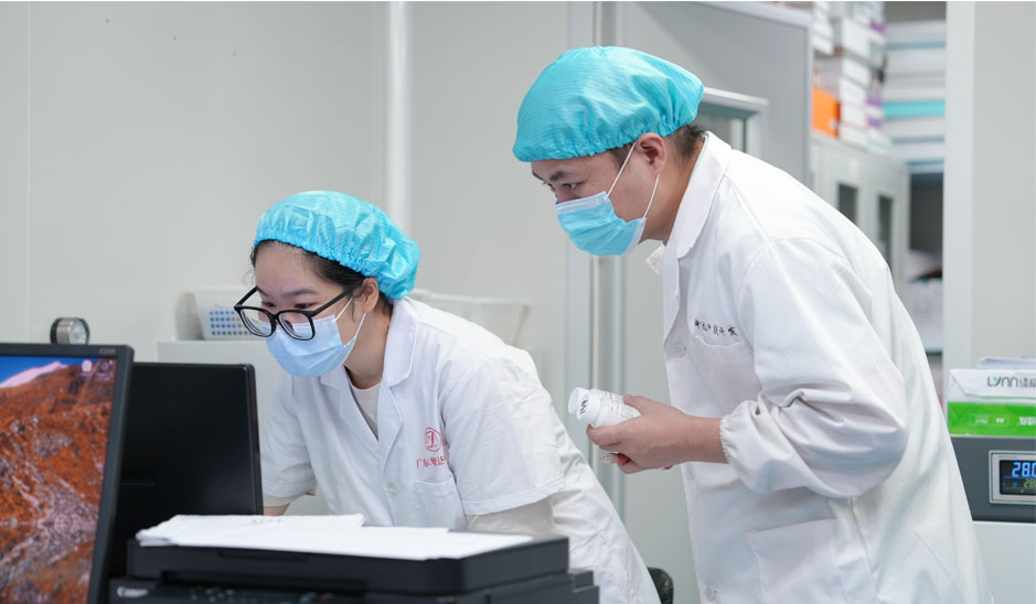 Skincare formula development team reviewing a product sample